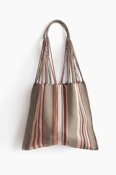 These versatile totes are handwoven by artisans in Chiapas, Mexico on a backstrap loom. Perfect for a beach day, the farmer's market, or as an everyday purse! Designed by and created exclusively for The Global Trunk. This bag is approx. 16" wide x 26" tall with the strap. Due to the handmade nature, height and width of bag can vary up to 10%. Hammock Bag, Muslin Wraps, Backstrap Loom, Everyday Purse, Cushion Cover Designs, Market Tote, Knitted Throws, Farmer's Market, Day Bag