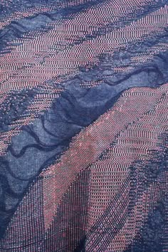 the blue and pink fabric has wavy lines on it