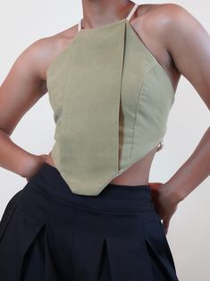 The Deonn Halter is a geometric shaped top with adjustable tying straps. Deonn is versatile and can be worn year round through all seasons. Wear as is for a sexy and flirty vibe, or with a short or long sleeve top underneath for a layered look. .. Backless halter top with adjustable tying straps in the back .. Geometric shape with front panel .. Lined with ivory linen fabric .. Features flat or round ivory tying straps .. Limited fabric, restock unavailable Halter Blouse, Backless Halter Top, Geometric Top, Style Clothes, Layered Look, Guinea Bissau, Mozambique, Brunei, Halter Top