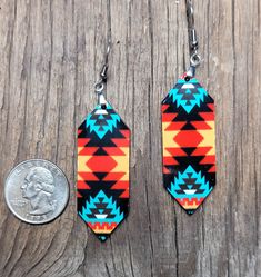 Crazy cute earrings with stainless steel hardware. Great to top off any outfit! Trendy, lightweight wood, the design has been sublimated onto one side - great vibrant color & design! Measurements are 2" x 3/4" not including hardware. Design placement may vary ever so slightly, as these are handmade. Sorry, no cancellations, returns or exchanges. Please allow 3 to 4 days for production. Package will be sent USPS First Class, upgrade in cart for faster delivery. Nickel-free Adjustable Southwestern Earrings, Multicolor Southwestern Style Drop Earrings, Southwestern Multicolor Drop Earrings, Southwestern Style Multicolor Drop Earrings, Nickel-free Red Southwestern Earrings, Nickel-free Southwestern Red Earrings, Nickel-free Southwestern Style Festival Earrings, Southwestern Style Red Nickel-free Earrings, Multicolor Nickel-free Southwestern Earrings