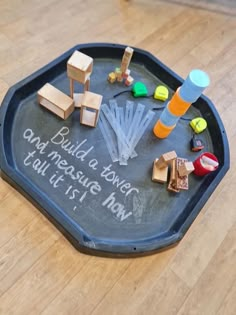 a chalkboard with toys and writing on it