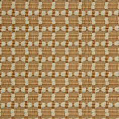 a brown and white checkered fabric with small squares on it's side,