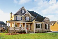 a large house with lots of windows in the front yard