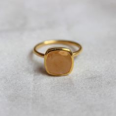 D E T A I L S - Material: 92.5 sterling silver Stone: Orange Moonstone The fit: True to US ring size Finish: Smooth and Gold-Plated to a high shine S H I P P I N G & P R O D U C T I O N - My current production time is 2-6 business days, which means after those days are up, your order ships! I make everything custom to order, by hand, but I promise you it's worth the wait! R U S H - M Y - O R D E R - If you're in a rush to get your pretty new pieces, please send me a message and I'll let you Moonstone Gemstone Stackable Rings As Gift, Moonstone Stackable Rings For Gifting, Minimalist Moonstone Ring With Natural Stones As Gift, Minimalist Moonstone Ring With Natural Stones, Minimalist Natural Moonstone Ring As Gift, Moonstone Ring With Bezel Setting As Gift, Moonstone Ring With Bezel Setting For Gift, Minimalist Natural Stone Moonstone Ring As A Gift, Orange Moonstone Ring As A Gift