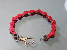 The bicycle enthusiast in your life will love this fun and eye catching bike chain bracelet. Besides showing one's passion for biking, it's a great conversation piece as well! So versatile too, as it can also be used as a keychain. Simply hook onto a backpack or belt loop (includes a free key ring so you can use it both ways). Made from real road, mountain and BMX bike chains. Swivel snap hooks are made of silver colored, nickel plated zinc alloy. Various colors available. Lobster clasp closure. Purple Bike, Bike Chain Bracelet, Green Bicycle, Etsy Bracelets, Bicycle Chains, Bicycle Chain, Bike Chain, Orange Gold, Bicycle Bike