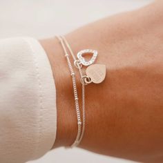 "Engraved Women's Personalized Heart Charm Sterling Silver Dainty Delicate Bracelet, Mom Gift --------------------------------------------------------------------------------------------------------------------- Delicate, classical, and feminine heart charm design. This gorgeous silver bracelet has got two 925 Sterling Silver heart pendants, on one of which you can engrave your personal message. GET CREATIVE and make it a ONE-OF-A-KIND with an engraving of your choice: initials, birthday, coordi Eye Ring Silver, Custom Engraved Bracelet, Personalized Leather Bracelet, Silver Heart Bracelet, Bff Gift, Hammered Hoop Earrings, Sterling Silver Heart Pendant, Bracelet Love, Love Bracelet