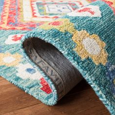 a close up of a rug on the floor with a hole in it that has been cut open