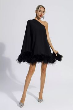 Add cuteness and elegance to your wardrobe with the Ailani Black Feather Trim One Shoulder Mini Dress! The one-shoulder style design with long sleeves adds a sense of fashion and luxury. The skirt is dotted with feathers, which look fluffy and adorable. Wear heels or boots to create a look that's unique to you. Perfect for cocktails or parties.  Dress Length: Approx 90cm Materials: 70% Polyester, 30% Cotton Gentle Dry Clean Only  Model is 5 ft 7 and wears size S  Colour may vary due to lighting One Shoulder Mini Dress, Feather Trim, Estilo Chic, Feather Dress, Feather Design, Black Feathers, Style Chic, Outerwear Women, Style Design