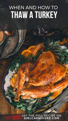 a roasted turkey on a platter with oranges and herbs in the background text reads, when and how to thaw a turkey