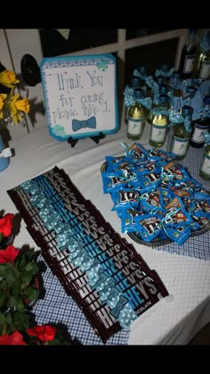 a table topped with lots of candy and flowers