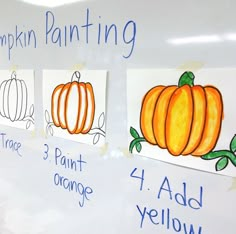 a white board with pumpkins painted on it