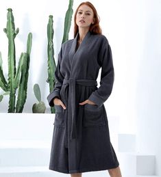 Getting home after a long day of work and tossing on a comfy robe is the best feeling. This Turkish cotton terry bathrobe for women was clearly made with those evenings in mind. It is made from high-quality cotton material that is both soft and cozy to keep you warm at all times. Featuring a tie belt, shawl collar, and pockets, this robe combines style and comfort to bring you a truly satisfying experience. Its versatility as a bathrobe makes it the perfect clothing accessory to wear anytime, an Super Soft Long Sleeve Robe For Loungewear, Cozy Relaxed Fit Robe For Lounging, Relaxed Fit Winter Robe For Loungewear, Winter Loungewear Robe With Relaxed Fit, Winter Relaxed Fit Loungewear Robe, Solid Color Winter Sleepwear For Lounging, Relaxed Fit Long Sleeve Lounging Robe, Solid Color Long Sleeve Robe For Loungewear, Long Sleeve Robe With Pockets For Home