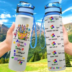 two water bottles are shown in front of a mountain range with puzzle pieces on them