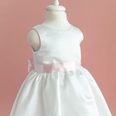 🌸 This Satin Flower Girl Wedding Dress with Pink Sash is unique for your lovely ones.  ✨ The Charming First Communion Dress  is customised for you. 🎀 This Floor  Length Dress with Pink Sash and Pink Bow will be the best preferred outfit for your Special occassions  🎉 The dress is made of high quality satin. Cotton lining inside the dress.  Pearl buttons are shining at the back of the dress. To match your dress, you can optionally choose the flower girl crown and/or flower girl purse . 🙂 Chec Princess-style Baptism Dress With Bow, Princess Dress With Satin Bow For Baptism, Princess Style Satin Dress For First Communion, Pink Princess Dress For Confirmation, Elegant Princess Dress For Baptism, Fitted Pink Princess Dress For Confirmation, White Princess Baptism Dress With Bow, First Communion Princess Dress With Satin Bow, Baptism Satin Dresses With Fitted Bodice