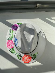 Beautiful Guatemalan hat with hand-painted flowers. The perfect accessory for any outfit! Artisan Brimmed Panama Hat For Spring, Hand Painted Brimmed Sun Hat For Spring, Hand Painted Curved Brim Sun Hat For Spring, Hand Painted Sun Hat With Curved Brim For Spring, Handmade Short Brim Panama Hat For Spring, Handmade Flat Brim Panama Hat For Spring, Hand Painted Wide Brim Straw Hat For Spring, Handmade White Fedora For Spring, Casual Hand Painted Hat With Short Brim