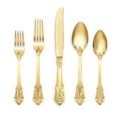 an assortment of gold colored utensils and spoons