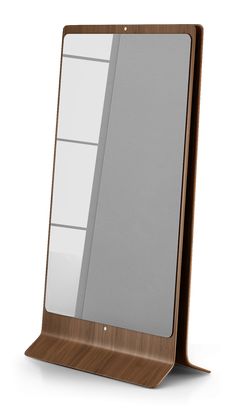 a wooden stand with a mirror on the front and back sides in different shades of brown