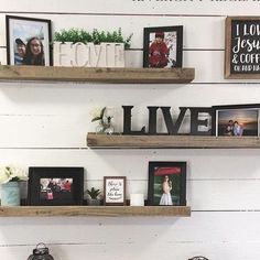 two wooden shelves with pictures and framed photos on them, one shelf has the word love