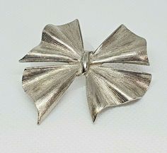 Vintage Silver Tone Bow Ribbon Brooch Textured MCM Classic Shiny Christmas Silver Brooches For Christmas Party, Elegant Silver Brooch For Christmas, Silver Christmas Party Brooch, Silver Christmas Party Brooches, Ribbon Brooch, Antique Costume Jewelry, Pewter Jewelry, Ribbon Art, Bow Ring