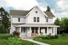 a white two story house with porch and covered front porch, surrounded by lush green grass