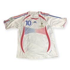 an old soccer jersey with the number 10 on it and red, white, and blue stripes