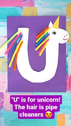 a unicorn made out of colored paper with the words u is for unicorn, the hair is pipe cleaners