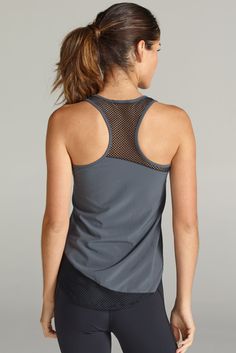 A lightweight, moisture-wicking workout tank that's perfect for your sweatiest workouts. Curved hemlines and strategic mesh placements. GRAPHITE is the new Fall "IT" color! Pair it with the Tatiana Capri for the complete look. By CHICHI Active. - Machine wash cold with like colors/gentle cycle. - Do not bleach/hang dry. - Made in the USA. Sleeveless Nylon Activewear For Yoga, Sleeveless Mesh Yoga Activewear, Mesh Sleeveless Yoga Activewear, Sleeveless Yoga Activewear With Mesh Back, Breathable Racerback Tops Sportswear, Breathable Racerback Sportswear Tops, Racerback Training Top With Mesh Back, Breathable Racerback Tops For Sportswear, Stretch Mesh Back Racerback Top