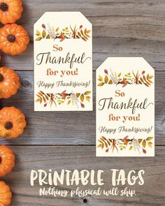 printable tags for thanksgiving with pumpkins and leaves on the table next to them