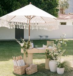 a table with an umbrella and baskets on it