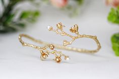 This beautiful arm band is made out of an intricate and detailed branch loaded with lots of magnolia flowers in different stages of blossoming. Each flower is decorated with pearl. The branch base is flexible and adjustable.  Measurements: The circumference is approximately 12 inch / 30 cm. Pls measure your arm to make sure this is a good fit.  * Comes wrapped in a beautiful gift bag/box. * Available in 14k gold, rose gold or silver plated brass. For updates, new products, one-of-a-kind's, speci Spring Wedding Bangle Bracelets, Elegant Wedding Bracelets For Spring, Elegant Spring Wedding Bracelets, Bridal Jewelry Gold, Magnolia Jewelry, Wedding Branches, Magnolia Branch, Beautiful Arms, Dainty Flowers