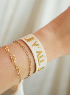 For our southern girlies! How cute are the boots on this bracelet! White embroidered bracelet with gold stitching. Our embroidered bracelets are adjustable to fit any wrist and are machine washable! Casual Gold Friendship Bracelets, Gold Adjustable Name Bracelet In Casual Style, Casual Gold Adjustable Name Bracelet, Casual Gold Name Bracelet Adjustable, Personalized Gold Casual Friendship Bracelets, Embroidered Bracelet, Stitching, Bracelet, Boots