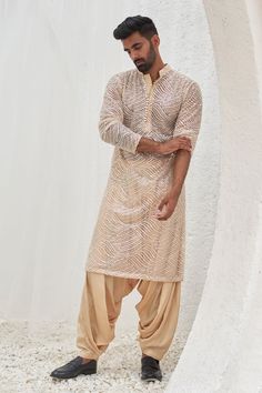 Beige full sleeves kurta with all over leaf swerve tonal sequin embroideries. Paired with a patiala. - Aza Fashions Kurta Patiala For Men, Traditional Dress For Men Indian, Kurta With Dhoti Pants For Men, Dhoti Outfit Men, Indian Outfits Men, Mens Kurta Designs Wedding, Stylish Kurta Pajama For Men, Wedding Guest Dress Men, Kurtas For Mens