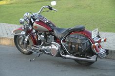 a red and black motorcycle parked on the street