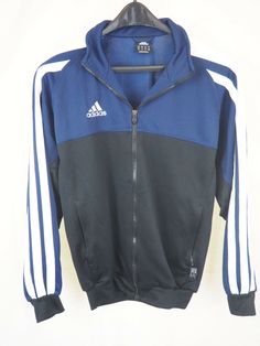 ADIDAS Navy & Black 3 Stripe CLIMALITE Track Jacket - Medium Navy and Blue Block -- 3 white stripes down sleeves Climalite Full Zipper Jacket 2 zipper pockets Measures: 24" underarm to underarm 28" in length 32" collar to end of sleeve If you have any questions, please feel free to ask. ** Most of my items are vintage or preloved.  I try my best to accurately describe or take pictures to show flaws or defects.  Please - if you need any additional information, I will be glad to help.  I do not sm Adidas Track Jacket For Training, Adidas Functional Track Jacket For Sports, Adidas Sportswear Track Jacket For Training, Adidas Sporty Track Jacket For Training, Adidas Logo Winter Track Jacket For Sports Events, Adidas Training Track Jacket, Adidas Winter Sports Track Jacket, Adidas Logo Functional Track Jacket For Training, Adidas Athleisure Track Jacket For Training