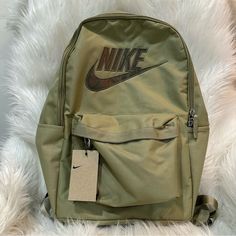 Olive Green Color With A Little Shimmer To It One Main Compartment And One Small Front Zippered Pocket. Two Side Pockets (One Zippered) Padded Adjustable Straps Made From Recycled Materials See Photos For Approximate Measurements Ynf 17542, 17544, 17543 Nike Student Backpack, Nike Standard Student Backpack, Nike Casual Bags For Students, Nike Everyday Standard Backpack, Casual Nike Bags For Students, Trendy Nike Travel Bag, Nike Casual Backpack For Students, Casual Nike Backpack For Students, Nike Green Bags For Travel