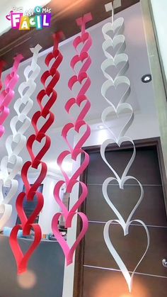 some paper hearts hanging from the ceiling