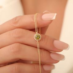 Indulge in the elegance of our handcrafted 14K Solid Gold Peridot Bracelet, a stunning piece that captures the beauty of nature in every detail. Each bracelet features exquisite round-cut peridot gemstones, celebrated for their vibrant green hue and believed to promote positivity and abundance. Surrounded by sparkling real diamonds, this bracelet combines timeless design with modern luxury, making it the perfect accessory for any occasion. Whether dressing up for a special event or adding a touc Wedding Bracelets With Gemstone Accents, Green Gemstone Bracelet Jewelry, Green Gemstone Accented Bracelet, Green Gemstone Accents Bracelet, Green Gemstone Accent Bracelet, Fine Jewelry Bracelets With Halo Setting For Gift, Halo Setting Bracelet Jewelry Gift, Green Diamond Bracelet For Gift, Green Gemstone Diamond Bracelet