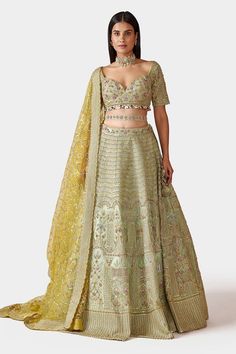 Light green lehenga with all-over resham, french knots, sequin and pipe crystal floral embroidered motifs. Comes with blouse, lemon net dupatta and belt.
Component: 4
Pattern: Embroidery
Type Of Work: Resham, French Knots, Sequin and Pipe Crystal
Neckline: Sweetheart
Sleeve Type: Half
Fabric: Organza and Net
Color: Green
Other Details: 
Blouse with bead and sequin drops
Scallop cutwork detail on sleeve hems
Dupatta with embroidered scallop border
Lehenga with side tie up
Closure: Back hook
Occas Sequin Lehenga, Trendy Outfits Indian, Scallop Border, Embroidered Motifs, Green Lehenga, Embroidered Lehenga, Saree Blouse Designs Latest, French Knots, Blouse Designs Latest