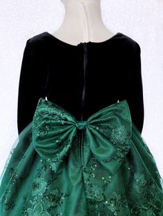 A gorgeous dress that can be worn for a Christmas party, birthday, photoshoot, or pageant! Long sleeve bodice is made out of soft velvet. The zipper can be found on the back of the dress. Comes with a detachable embroidery bow. The skirt is made out of a detailed embroidery fabric with lining underneath. One last layer of lining with crinoline attached underneath everything to give the dress shape. *Mannequin has petticoat to show detail. !PETTICOAT NOT INCLUDED! LINK TO PURCHASE PETTICOAT: http Christmas Wedding Princess Dress With Bow, Elegant Embroidered Fitted Princess Dress, Holiday Ball Gown For Dress-up, Fitted Embroidered Princess Dress For Party, Embroidered Fitted Princess Dress For Party, Green Princess Dress With Floral Applique For Wedding, Green Floral Applique Princess Dress For Wedding, Christmas Ball Gown For Dress-up, Elegant Holiday Princess Dress For Celebration