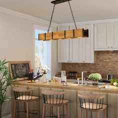 a kitchen island with four stools in front of it