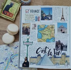 an open travel book with pictures and magnets on the pages, along with other items