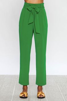 High Waisted Pegged Pants with Front Pleats and Optional Waist Tie Model is 5'9" tall, 34" Chest, 25" waist, and 34" hips and wearing a size small Material: 65% Cotton | 33% Polyester | 2% Spandex Color: Green Style No. AP1212 Available: Small | Medium | Large Cot Pant, Pegged Pants, Peg Pants, Gifts 2022, Ruffle Jumpsuit, Mustard Dressing, Green Style, Pants Large, Shoulder Cut