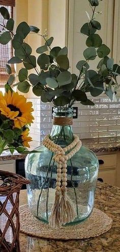 a vase filled with flowers on top of a table