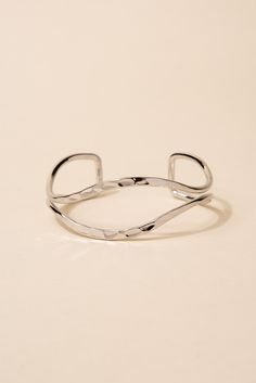 Made from high-quality metal, this bracelet features a unique open eyelid design that is sure to catch the eye. The hammered texture adds an extra dimension of interest to the piece. This cuff is adjustable to fit a variety of wrist sizes, ensuring a comfortable and secure fit. SizeLength: 6.5 in (16.51 cm)Width: 1 in (2.54 cm) Quality Made with a lightweight metal alloy to ensure that the bracelet is easy to wear and that it lasts for longer. Made with a glossy finish that make the bracelets be Trendy Nickel-free Metal Cuff Bracelet, Modern Adjustable Open Cuff Bracelet, Adjustable Hammered Cuff Bracelet, Adjustable Hammered Cuff Bangle, Adjustable Modern Open Band Bracelets, Modern Adjustable Open Band Bracelets, Modern Adjustable Open Band Bracelet, Adjustable Nickel Free Trendy Cuff Bracelet, Trendy Adjustable Nickel-free Cuff Bracelet