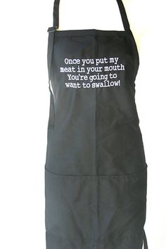 a black apron with white writing on it