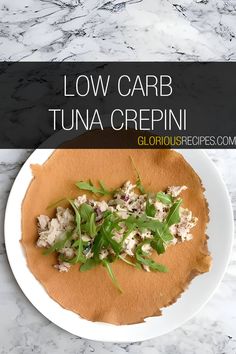 low carb tuna crepini on a white plate with green garnish