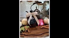 a wooden cutting board topped with lots of different types of spices and bottles filled with liquid