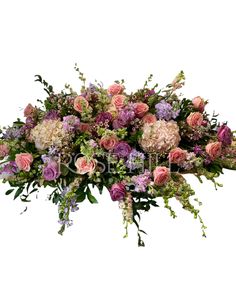 an arrangement of flowers on a white background