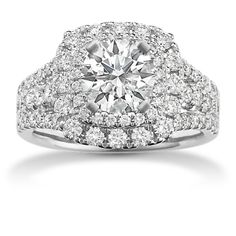 a diamond ring with two rows of diamonds on the band and an oval center surrounded by round