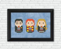 the three harry potters cross stitch pattern in a black frame on a white brick wall